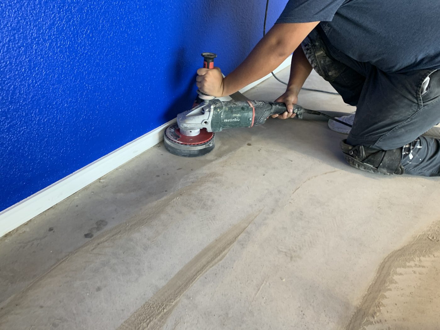 Classic installer diamond grinding a concrete floor